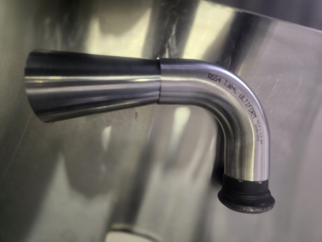Close-up of the 304L stainless taper pipe stepping from 75mm to 50mm